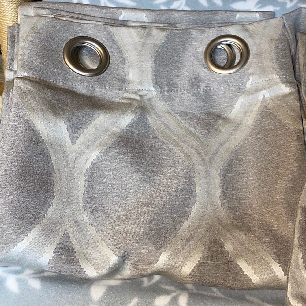 1 pair of 54inx 106in curtains with metal grommets.